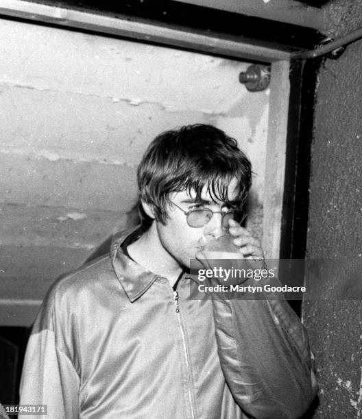 Portrait of Liam Gallagher of Oasis backstage at a music venue in London, 1994.