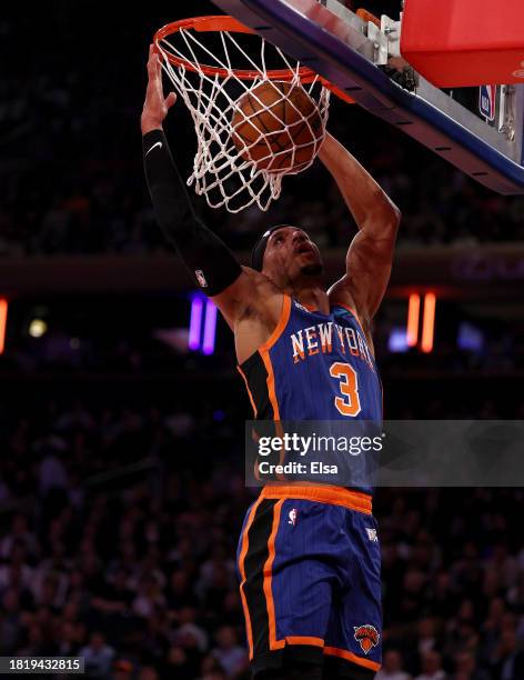 Josh Hart of the New York Knicks dunks the ball against the Charlotte Hornets during the first half of an NBA In-Season Tournament game at Madison...