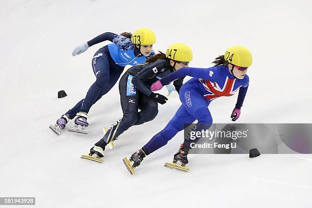 Kathryn Thomson of Great Britain , Sayuri Shimizu of Japan and Sofia Prosvirnova of Russia compete in the Women's 500m Pre-Preliminaries during day...