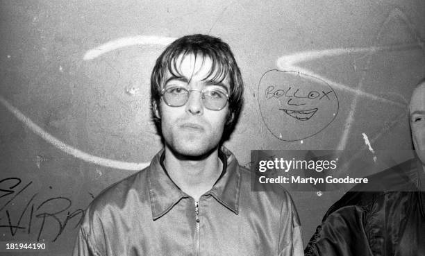 Liam Gallagher of English rock band Oasis backstage at a music venue in London, 1994.