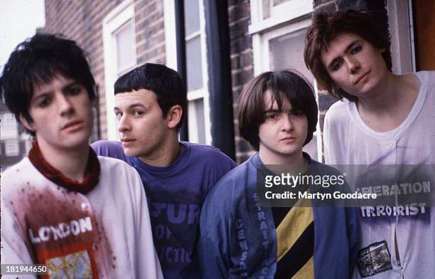 Group portrait of the Manic Street Preachers at Martyn Goodacre's flat, Old Kent Road, London, January 1991. L-R Richey Edwards, James Dean...