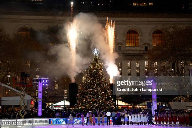 Ice skaters watch fireworks during the 2023 Bryant Park tree lighting ceremony on November 28, 2023 in New York City.