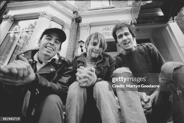 Group portrait of American grunge band Nirvana in Shepherd's Bush, London, October 1990. L-R Dave Grohl, Kurt Cobain and Krist Novoselic.