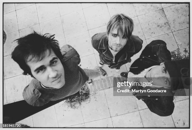 Group portrait of American grunge band Nirvana in Shepherd's Bush, London, October 1990. L-R Krist Novoselic, Kurt Cobain and Dave Grohl.