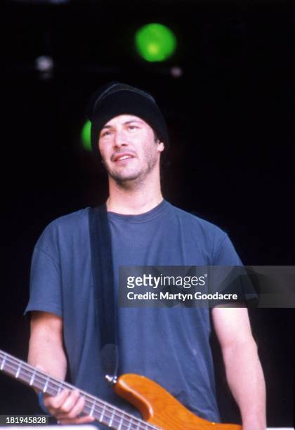 Actor Keanu Reeves performs on stage with his band Dogstar, Glastonbury, 1994.