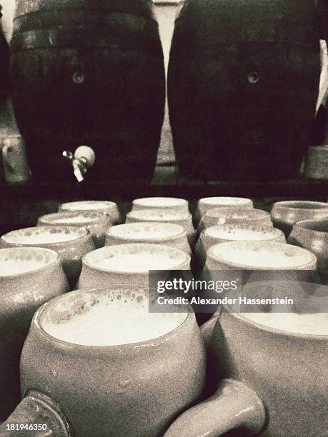 Beer mugs and wooden beer barrel during day 6 of the Oktoberfest 2013 beer festival at Theresienwiese on September 26, 2013 in Munich, Germany. The...