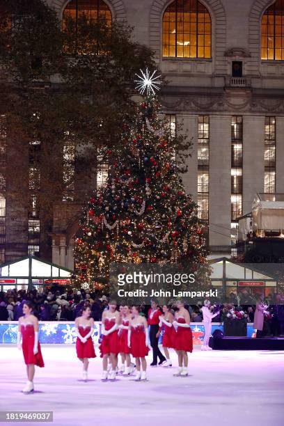 Ice skaters are seen in front of the tree during the 2023 Bryant Park tree lighting ceremony on November 28, 2023 in New York City.