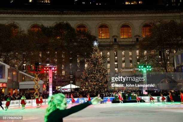 Ice skaters are seen in front of the tree during the 2023 Bryant Park tree lighting ceremony on November 28, 2023 in New York City.