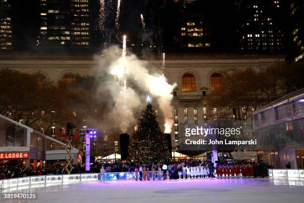 Ice skaters watch fireworks during the 2023 Bryant Park tree lighting ceremony on November 28, 2023 in New York City.