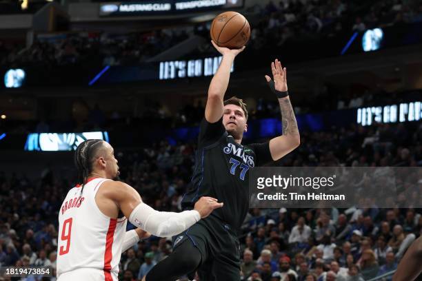 Luka Doncic of the Dallas Mavericks shoots the ball against Dillon Brooks of the Houston Rockets in the first half during an NBA In-Season Tournament...