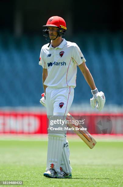 Jake Carder of the Redbacks leaves the ground after getting out to Fergus O'Neill of the Bushrangers during the Sheffield Shield match between South...