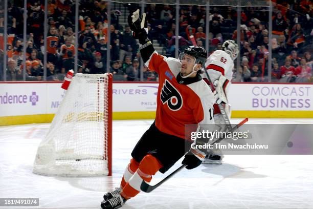 Travis Konecny of the Philadelphia Flyers reacts after scoring during the second period against the Carolina Hurricanes at the Wells Fargo Center on...