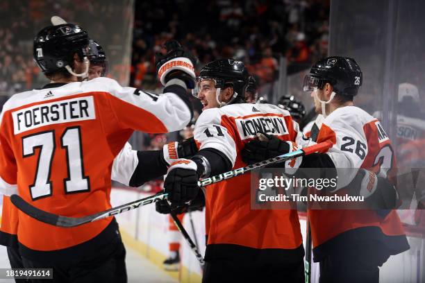 Travis Konecny of the Philadelphia Flyers reacts with teammates after scoring during the second period against the Carolina Hurricanes at the Wells...