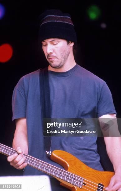 Actor Keanu Reeves performs on stage with his band Dogstar, Glastonbury, 1994.