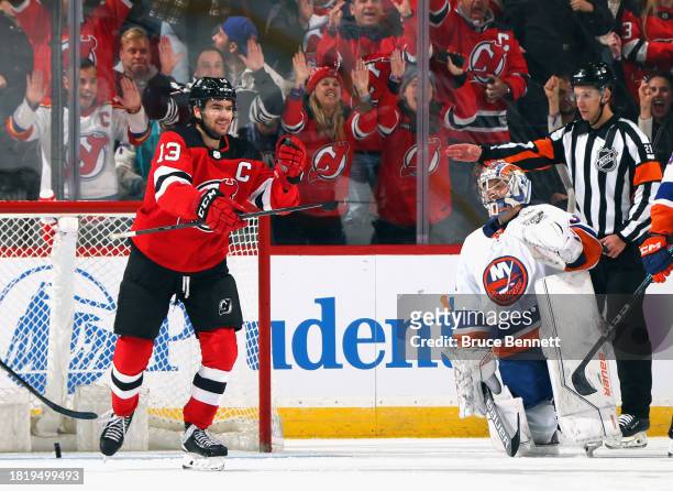 Nico Hischier of the New Jersey Devils scores the game-tying powerplay goal against Ilya Sorokin of the New York Islanders during the third period at...
