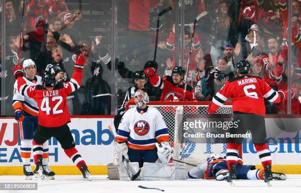 Curtis Lazar of the New Jersey Devils celebrates his game winning goal at 19:37 of the third period against Ilya Sorokin of the New York Islanders at...