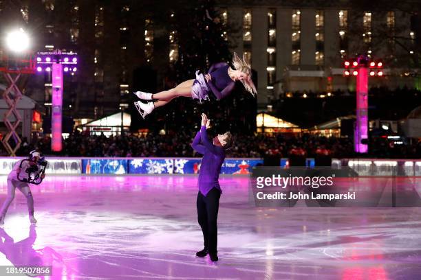 Alexa Knierim and Brandon Frazier skate during the 2023 Bryant Park tree lighting ceremony on November 28, 2023 in New York City.