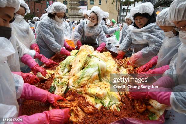 South Koreans make Kimchi to donate to the poor in preparation for winter at the Jogyesa buddhist temple on November 29, 2023 in Seoul, South Korea....