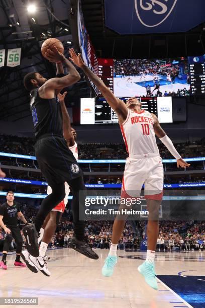 Kyrie Irving of the Dallas Mavericks shoots against Jabari Smith Jr. #10 of the Houston Rockets in the first half during an NBA In-Season Tournament...