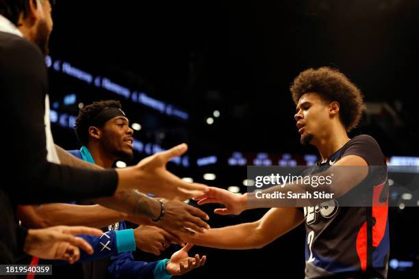 Cameron Johnson of the Brooklyn Nets celebrates with the bench during the second half of an NBA In-Season Tournament game against the Toronto Raptors...