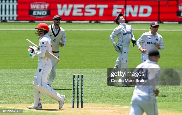 Alex Carey of the Redbacks leaves the ground after getting out to Fergus O'Neill of the Bushrangers caught behind during the Sheffield Shield match...