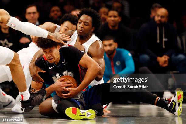 Anunoby of the Toronto Raptors battles Cameron Johnson of the Brooklyn Nets for the ball during the second half of an NBA In-Season Tournament game...