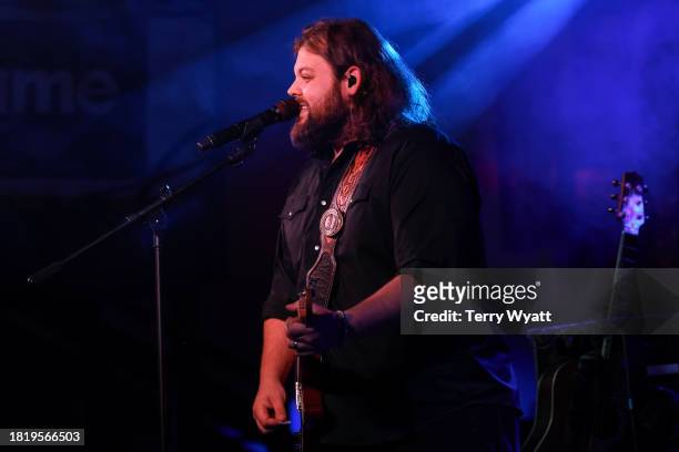 Dillon Carmichael performs on stage at 3rd & Lindsley on November 28, 2023 in Nashville, Tennessee.