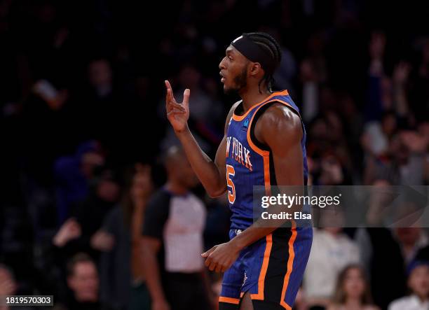 Immanuel Quickley of the New York Knicks celebrates his three point shot during the second half of an NBA In-Season Tournament game against the...