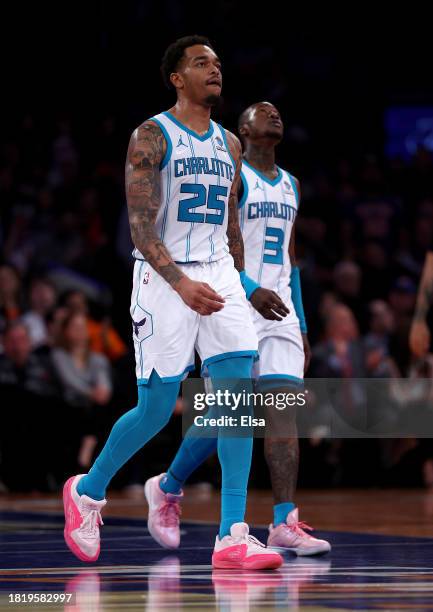 Washington and Terry Rozier of the Charlotte Hornets react during the second half of an NBA In-Season Tournament game against the New York Knicks at...