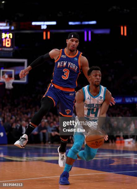 Ish Smith of the Charlotte Hornets heads for the net as Josh Hart of the New York Knicks defends during the second half of an NBA In-Season...