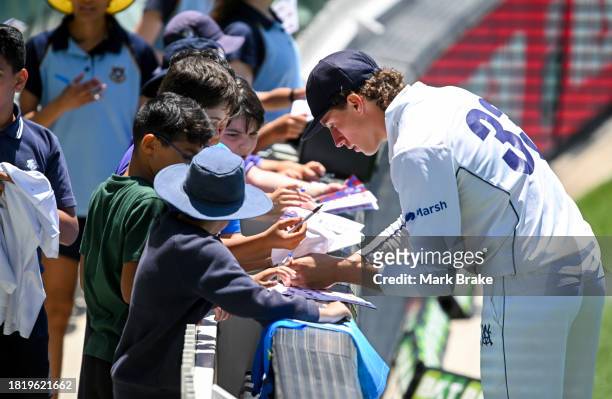 Doug Warren of the Bushrangers signs autographs during the Sheffield Shield match between South Australia and Victoria at Adelaide Oval, on November...