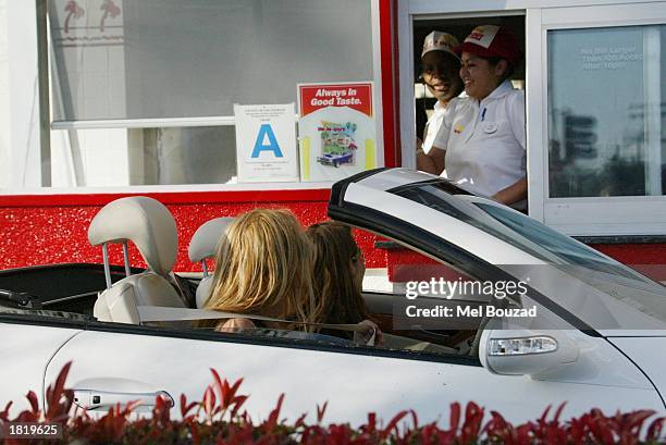 Musician Britney Spears and friend drive through In-N-Out Burger on February 27, 2003 in Hollywood, California.