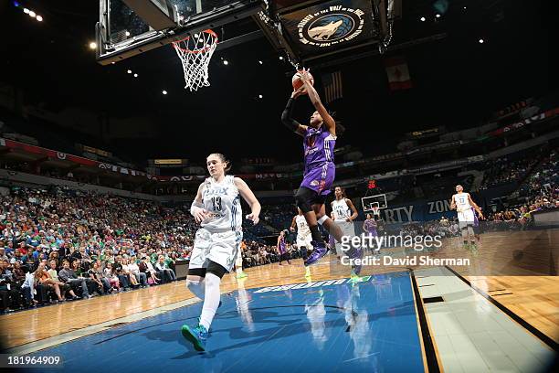Lindsay Whalen of the Minnesota Lynx tries to stop the fast break against Alexis Hornbuckle of the Phoenix Mercury during the WNBA Western Conference...