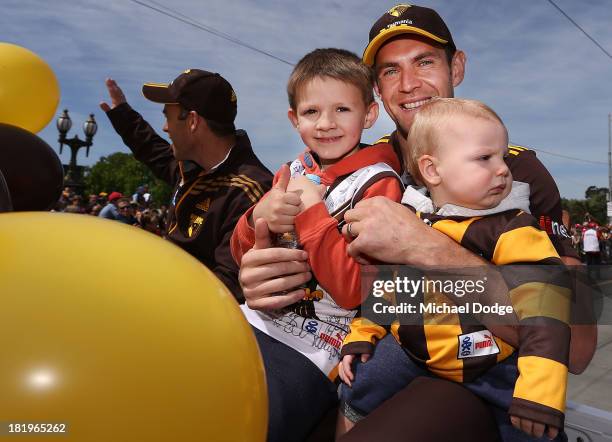 Luke Hodge of the Hawks poses with his kids during the 2013 AFL Grand Final Parade on September 27, 2013 in Melbourne, Australia.