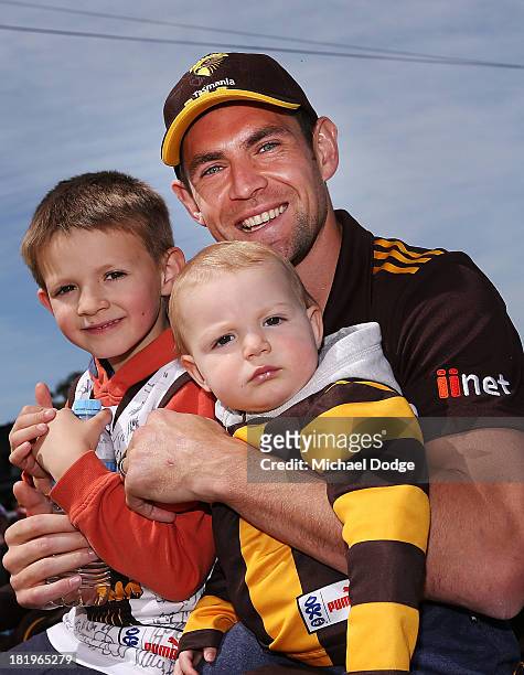 Luke Hodge of the Hawks poses with his kids during the 2013 AFL Grand Final Parade on September 27, 2013 in Melbourne, Australia.