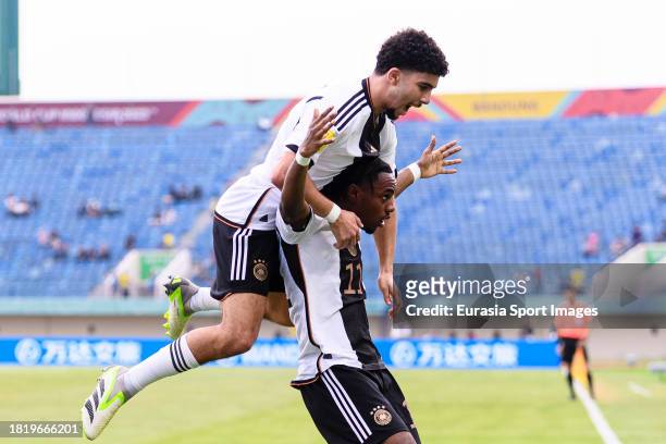 Charles Herrmann of Germany celebrates his goal with teammates during FIFA U-17 World Cup Round of 16 match between Germany and USA at Si Jalak...