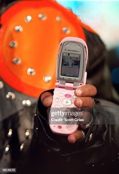 Cam'Ron shows off his pink cell phone as he appears on MTV's TRL at the MTV studios February 27, 2003 in New York City.