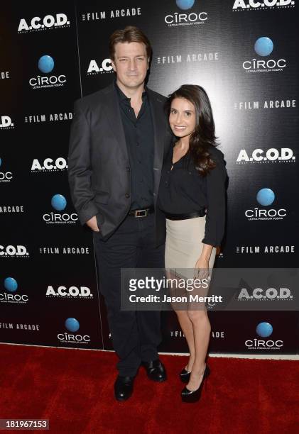 Actor Nathan Fillion and actress Mikaela Hoover attend the premiere of The Film Arcade's "A.C.O.D." at the Landmark Theater on September 26, 2013 in...