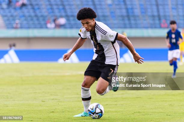 Paris Brunner of Germany runs with the ball during FIFA U-17 World Cup Round of 16 match between Germany and USA at Si Jalak Harupat Stadium on...