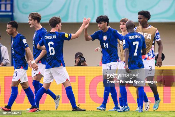 Taha Habroune of United States celebrates his goal with teammates during FIFA U-17 World Cup Round of 16 match between Germany and USA at Si Jalak...
