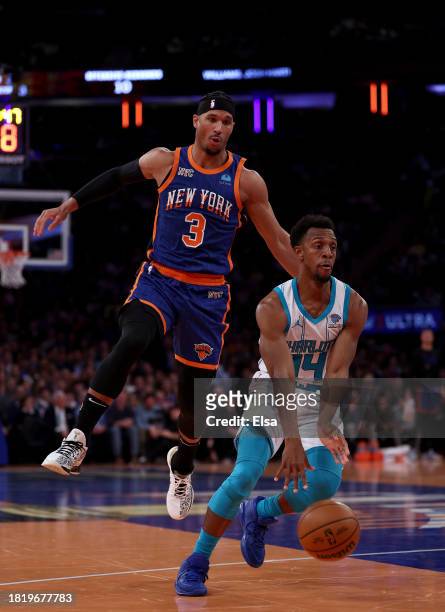 Ish Smith of the Charlotte Hornets heads for the net as Josh Hart of the New York Knicks defends during the second half of an NBA In-Season...