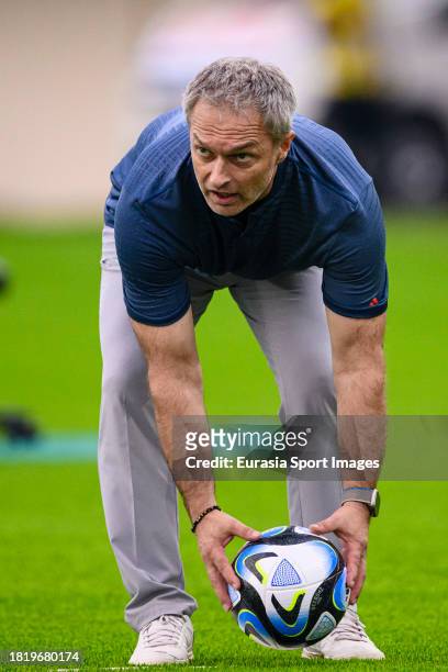 Germany Head Coach Christian Wueck picks up the ball during FIFA U-17 World Cup Round of 16 match between Germany and USA at Si Jalak Harupat Stadium...