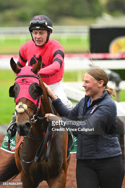 Harry Coffey riding Tommy after winning Race 5, the Evergreen Turf Handicap, during Melbourne Racing at Sandown Lakeside on November 29, 2023 in...