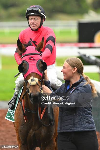 Harry Coffey riding Tommy after winning Race 5, the Evergreen Turf Handicap, during Melbourne Racing at Sandown Lakeside on November 29, 2023 in...
