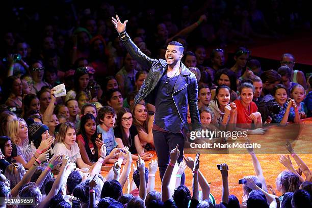Guy Sebastian performs during the Nickelodeon Slimefest 2013 matinee show at Sydney Olympic Park Sports Centre on September 27, 2013 in Sydney,...