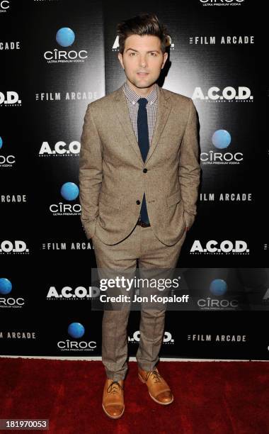 Actor Adam Scott arrives at the Los Angeles Premiere "A.C.O.D." at the Landmark Theater on September 26, 2013 in Los Angeles, California.