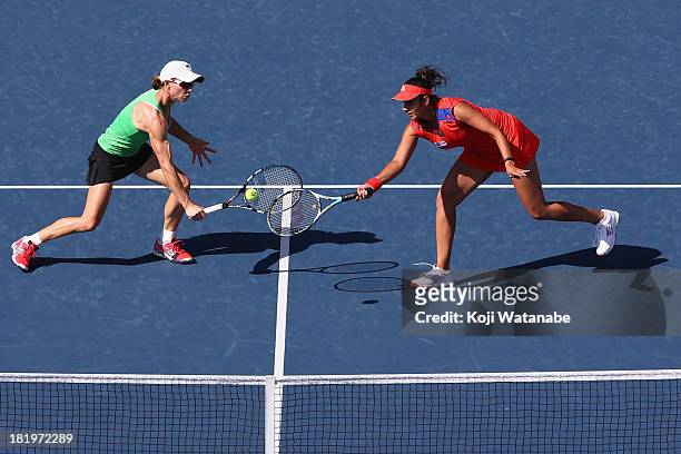 Cara Black of Zimbabwe and Sania Mirza of India in action during their match against Suwei Hsieh of Chinese Taipei and Shuai Peng of China in the...