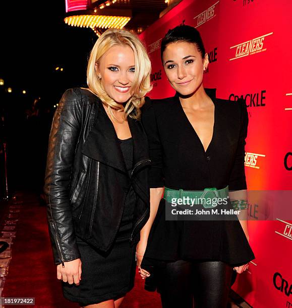 Actresses Emily Osment and Emannuelle Chriqui attend the premiere of Crackle's new original digital series "Cleaners" at the Cary Grant Theater on...