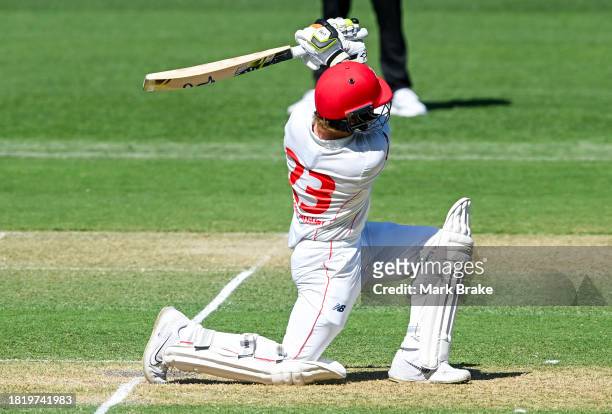 Jake Fraser-McGurk of the Redbacks hits six during the Sheffield Shield match between South Australia and Victoria at Adelaide Oval, on November 29...