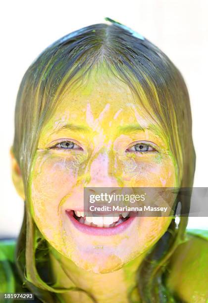 Participants in Slimefest come out covered in green slime after the first show during the Nickelodeon Slimefest 2013 matinee show at Sydney Olympic...